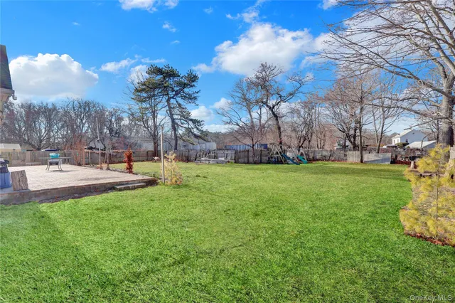 a view of a park with large trees
