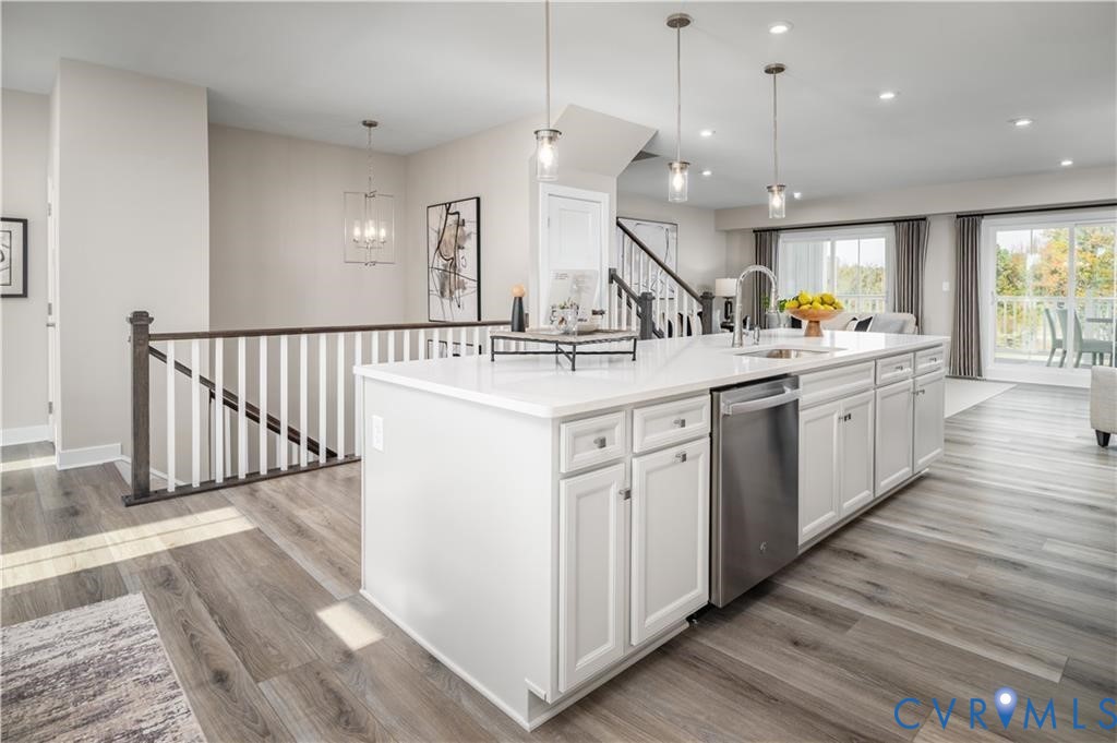 2806 Calgary Loop Chester, VA 23831 - Photo 6 of 20 a kitchen with a sink and wooden floor