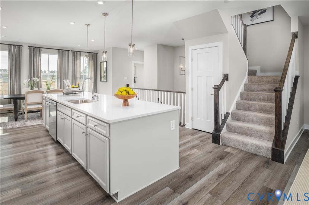 2806 Calgary Loop Chester, VA 23831 - Photo 7 of 20 a open kitchen with a sink and wooden floor
