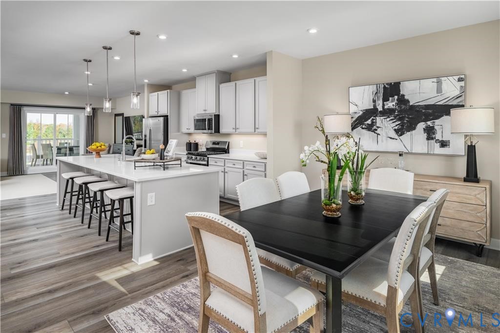 2806 Calgary Loop Chester, VA 23831 - Photo 8 of 20 a view of a dining room with furniture