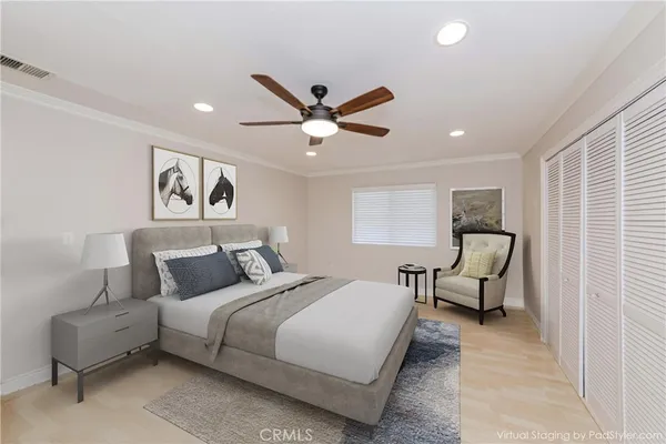 a bedroom with a bed and a couch