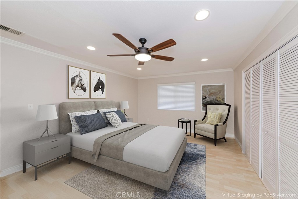 5431 Marion Avenue Cypress, CA 90630 - Photo 12 of 22 a bedroom with a bed and a couch