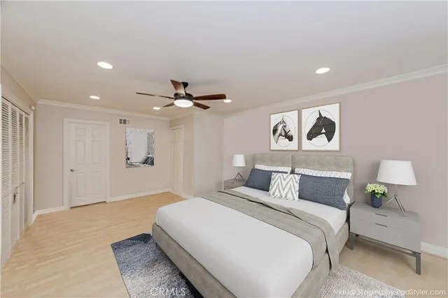 a bedroom with a bed and a painting on the wall