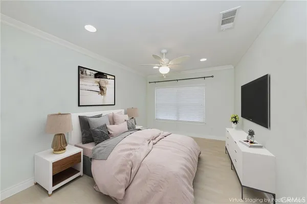 a bedroom with bed and a flat screen tv