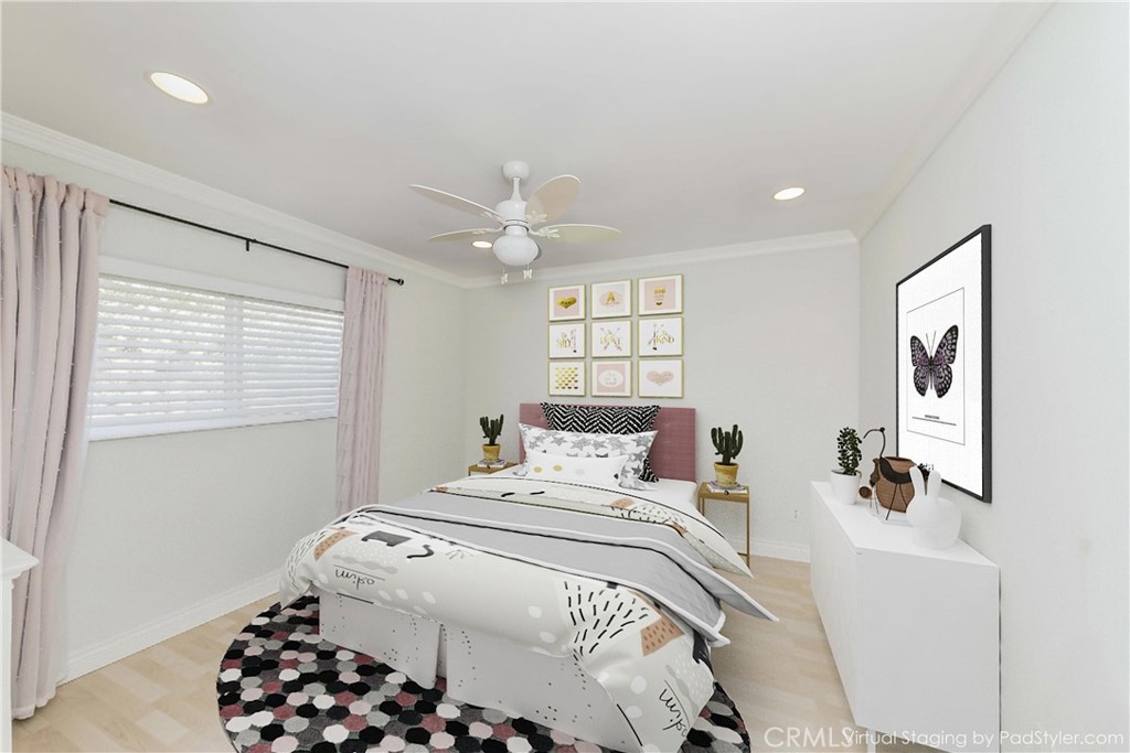 5431 Marion Avenue Cypress, CA 90630 - Photo 17 of 22 a bedroom with a bed and a chandelier