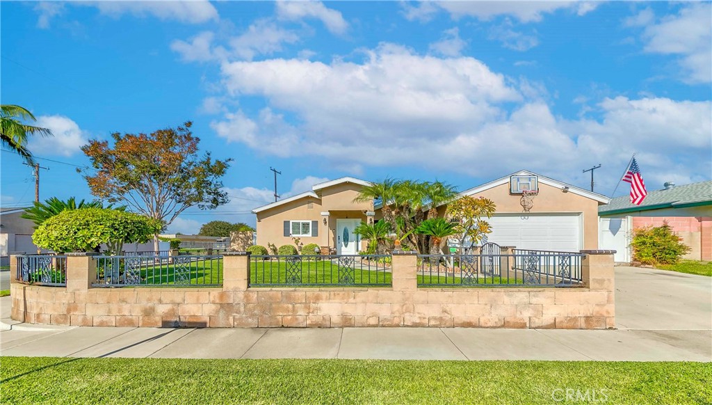 5431 Marion Avenue Cypress, CA 90630 - Photo 3 of 22 a view of a house with a yard