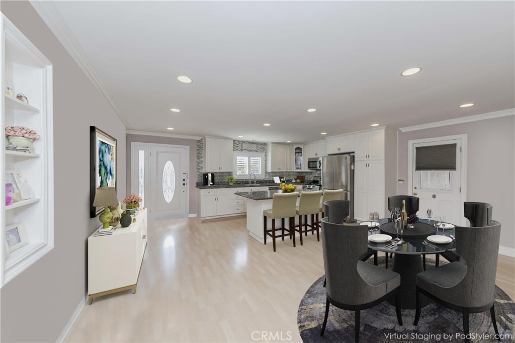 5431 Marion Avenue Cypress, CA 90630 - Photo 9 of 22 a living room with lots of furniture kitchen view and a dining table