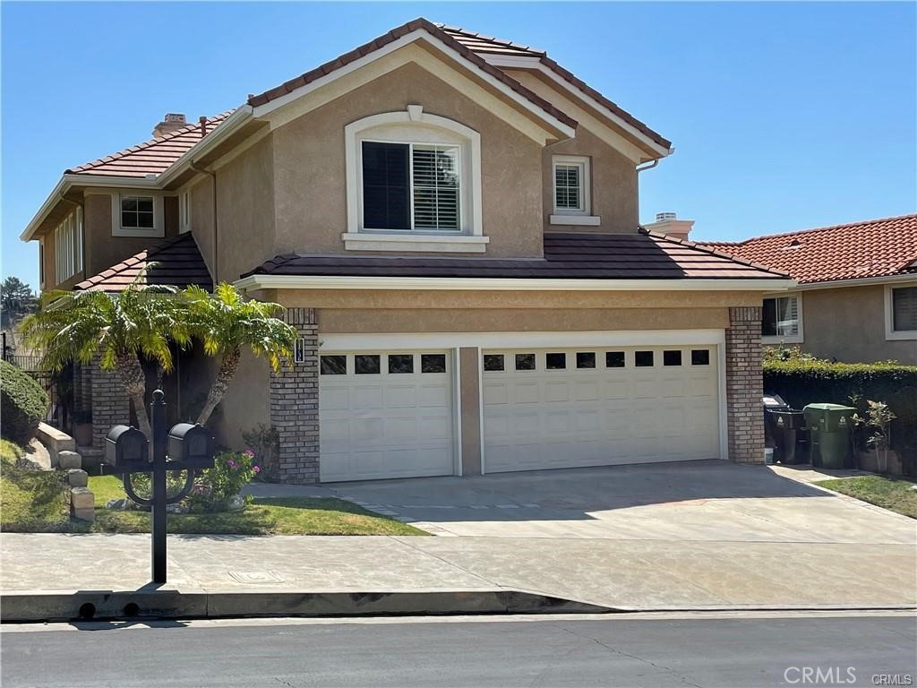 11736 Mariposa Bay Lane Porter Ranch, CA 91326 - Photo 1 of 22 Front view with three car garage