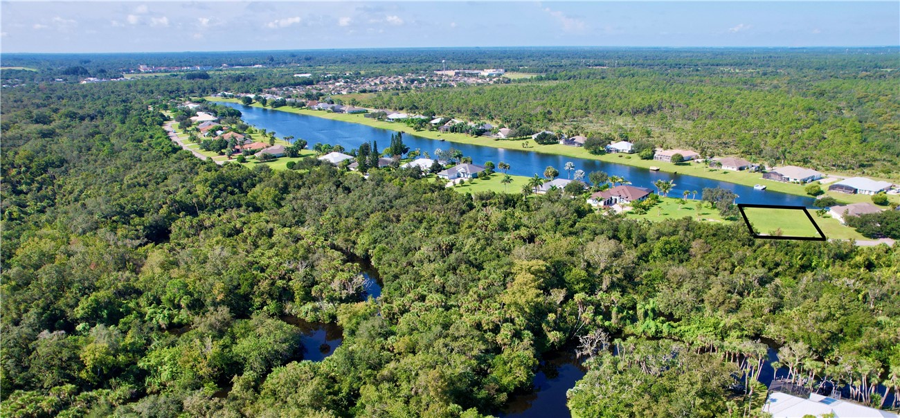 1552 Eagles Circle Sebastian, FL 32958 - Photo 14 of 16 a view of a city with lush green forest