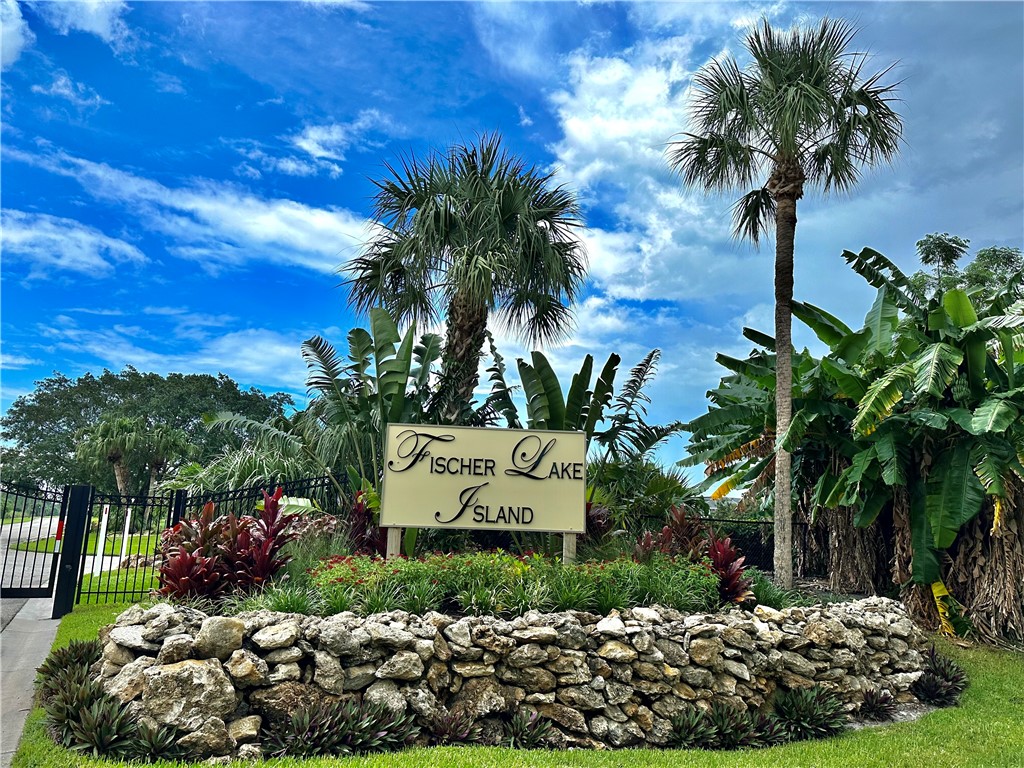 1552 Eagles Circle Sebastian, FL 32958 - Photo 16 of 16 a sign that is sitting in front of flowers