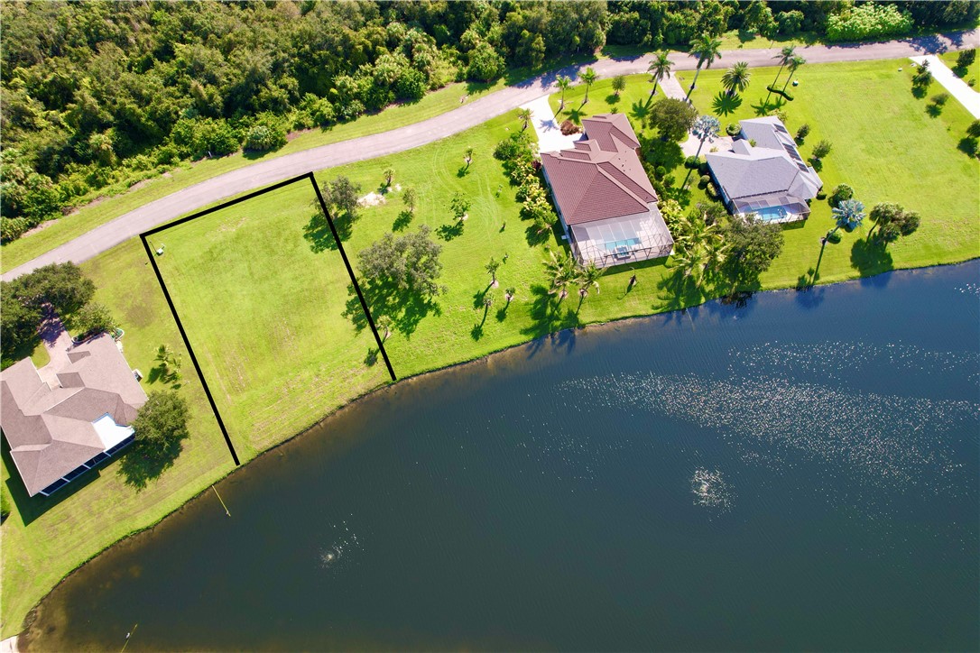 1552 Eagles Circle Sebastian, FL 32958 - Photo 5 of 16 a view of a swimming pool with a yard