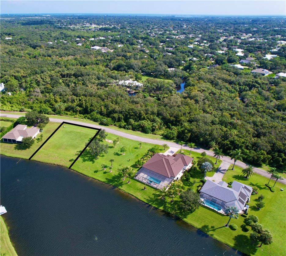 1552 Eagles Circle Sebastian, FL 32958 - Photo 7 of 16 an aerial view of a house with a garden