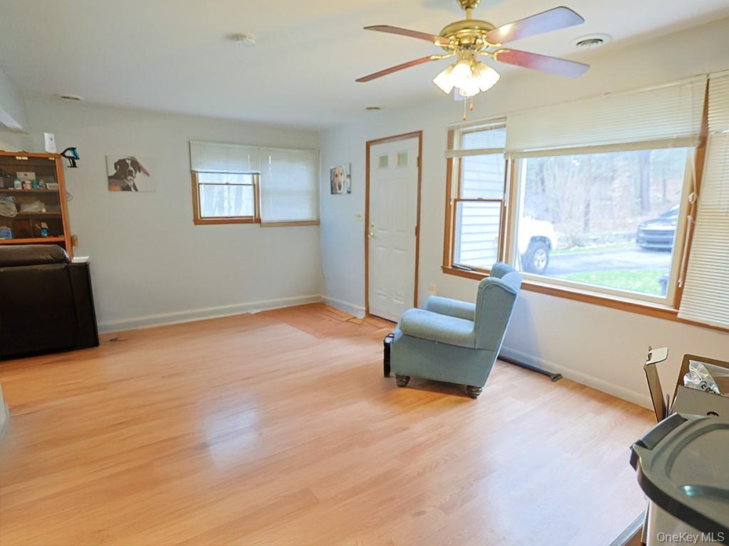 68 Kennel Road Cuddebackville, NY 12729 - Photo 11 of 21 a living room with furniture and a large window