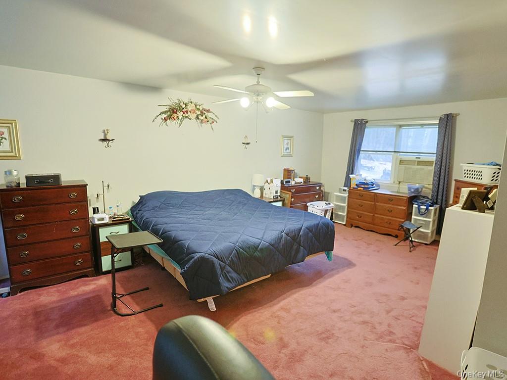 68 Kennel Road Cuddebackville, NY 12729 - Photo 19 of 21 a bedroom with a bed and furniture