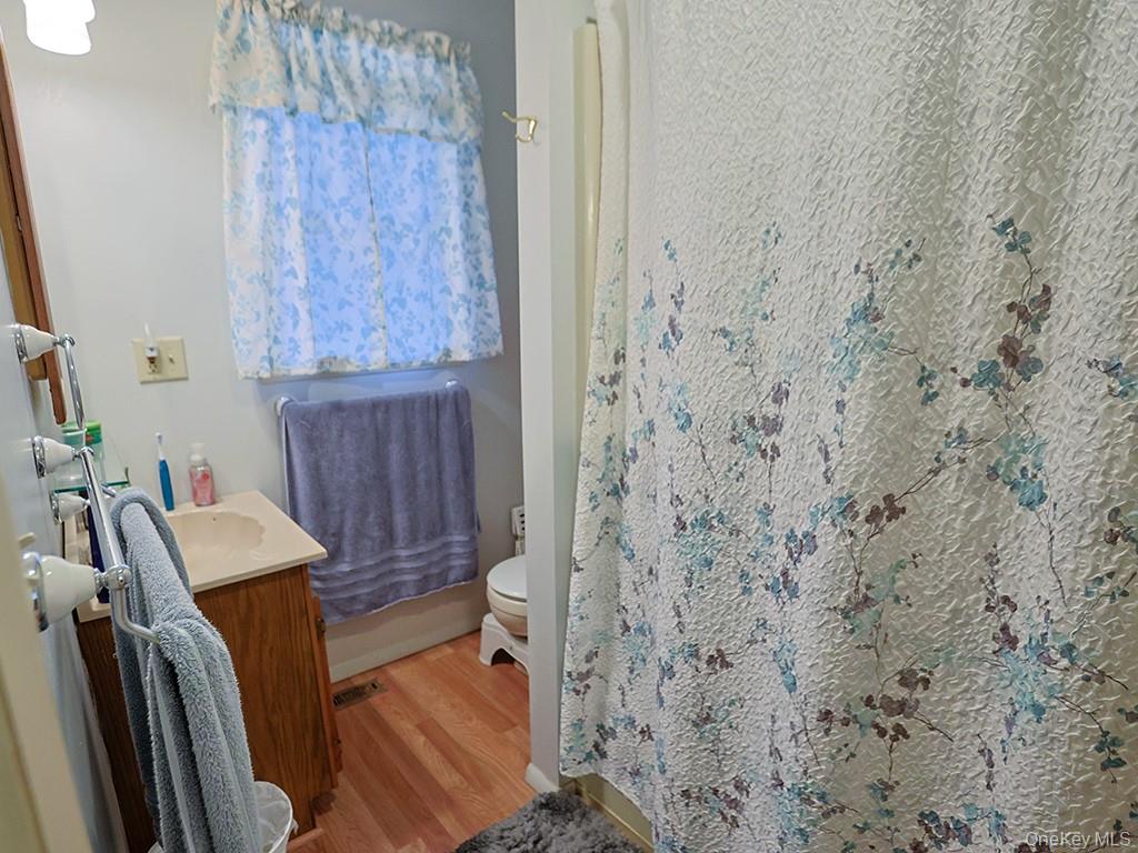 68 Kennel Road Cuddebackville, NY 12729 - Photo 21 of 21 a bathroom with a sink a toilet and shower