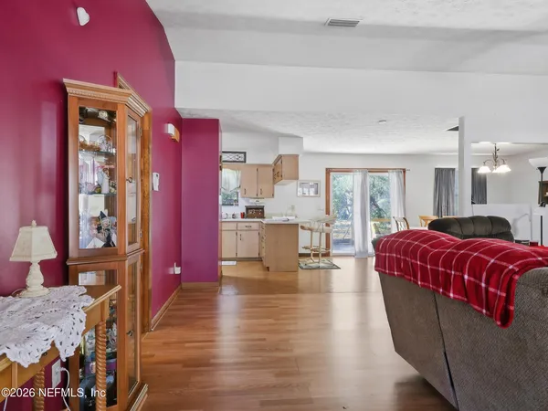 a living room with furniture ceiling fan and a rug