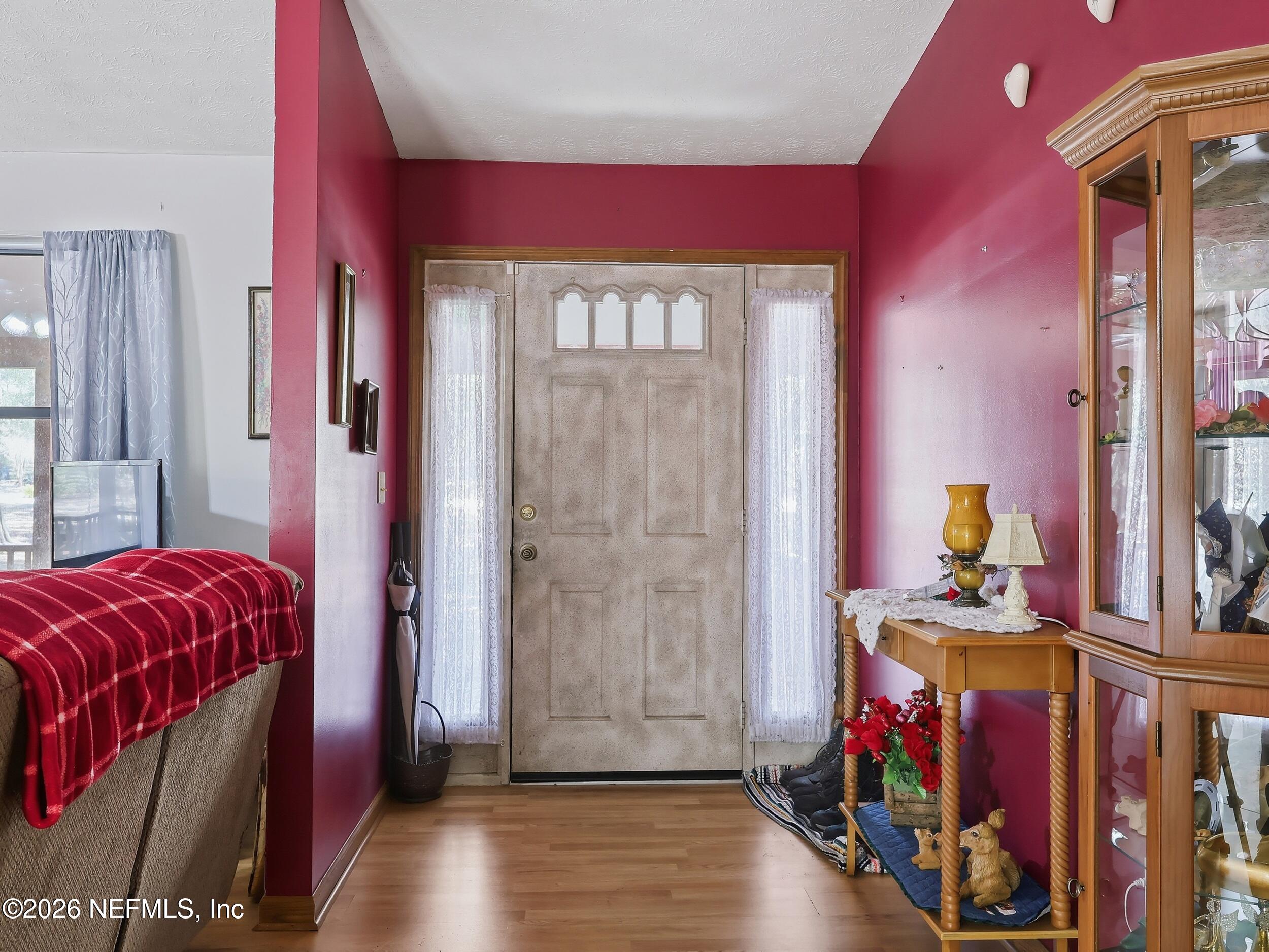 8336 Singleton Place Keystone Heights, FL 32656 - Photo 13 of 56 a bedroom with a bed and a window