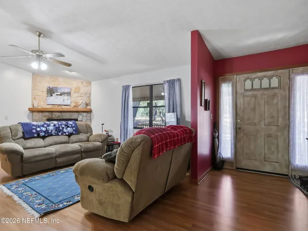 a kitchen with kitchen island a table and chairs