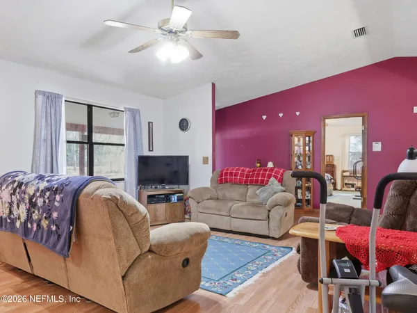 a kitchen with cabinets appliances a sink and a counter top space