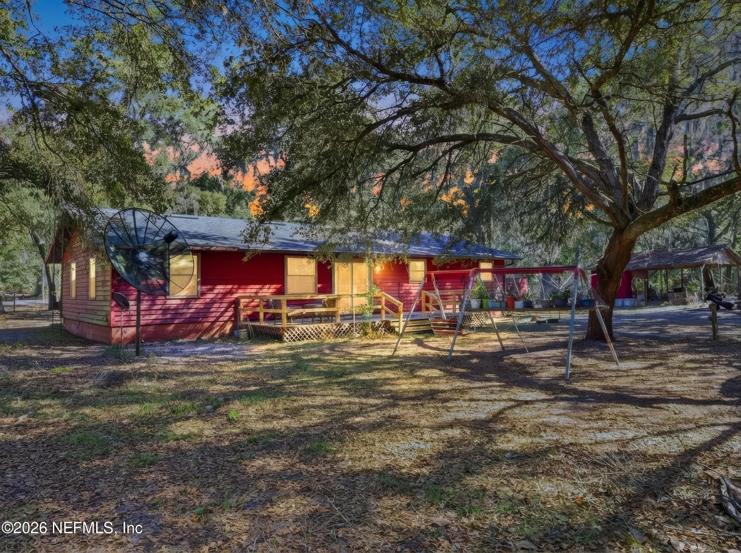 8336 Singleton Place Keystone Heights, FL 32656 - Photo 16 of 44 a view of a yard with large trees