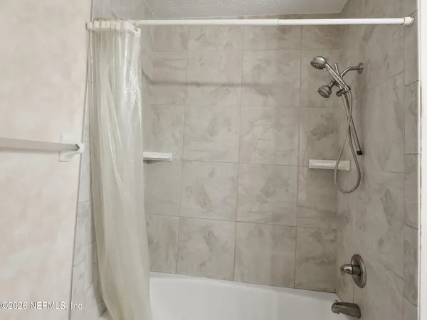 a view of a bedroom with a large window