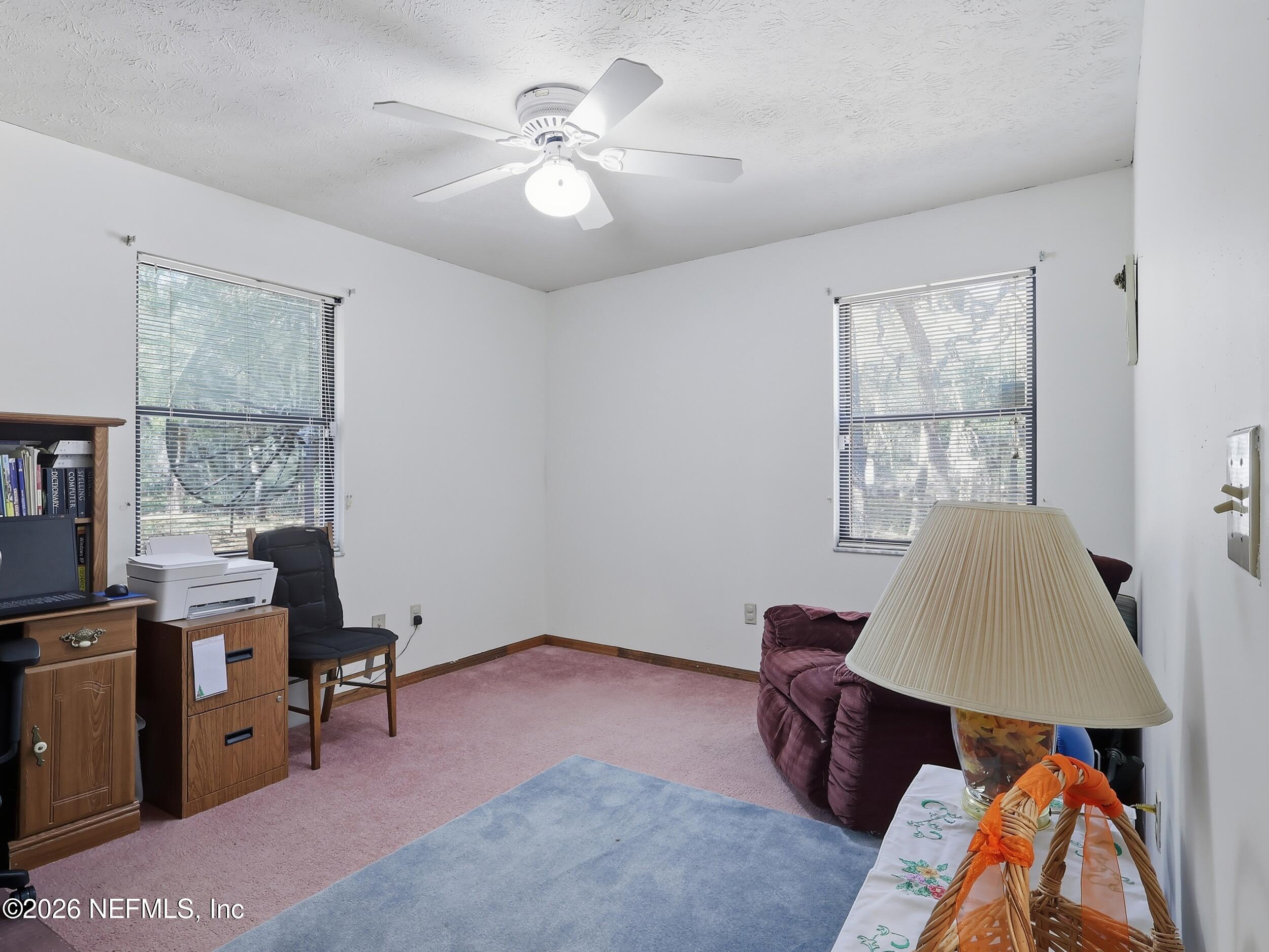 8336 Singleton Place Keystone Heights, FL 32656 - Photo 34 of 56 a living room with furniture and a window