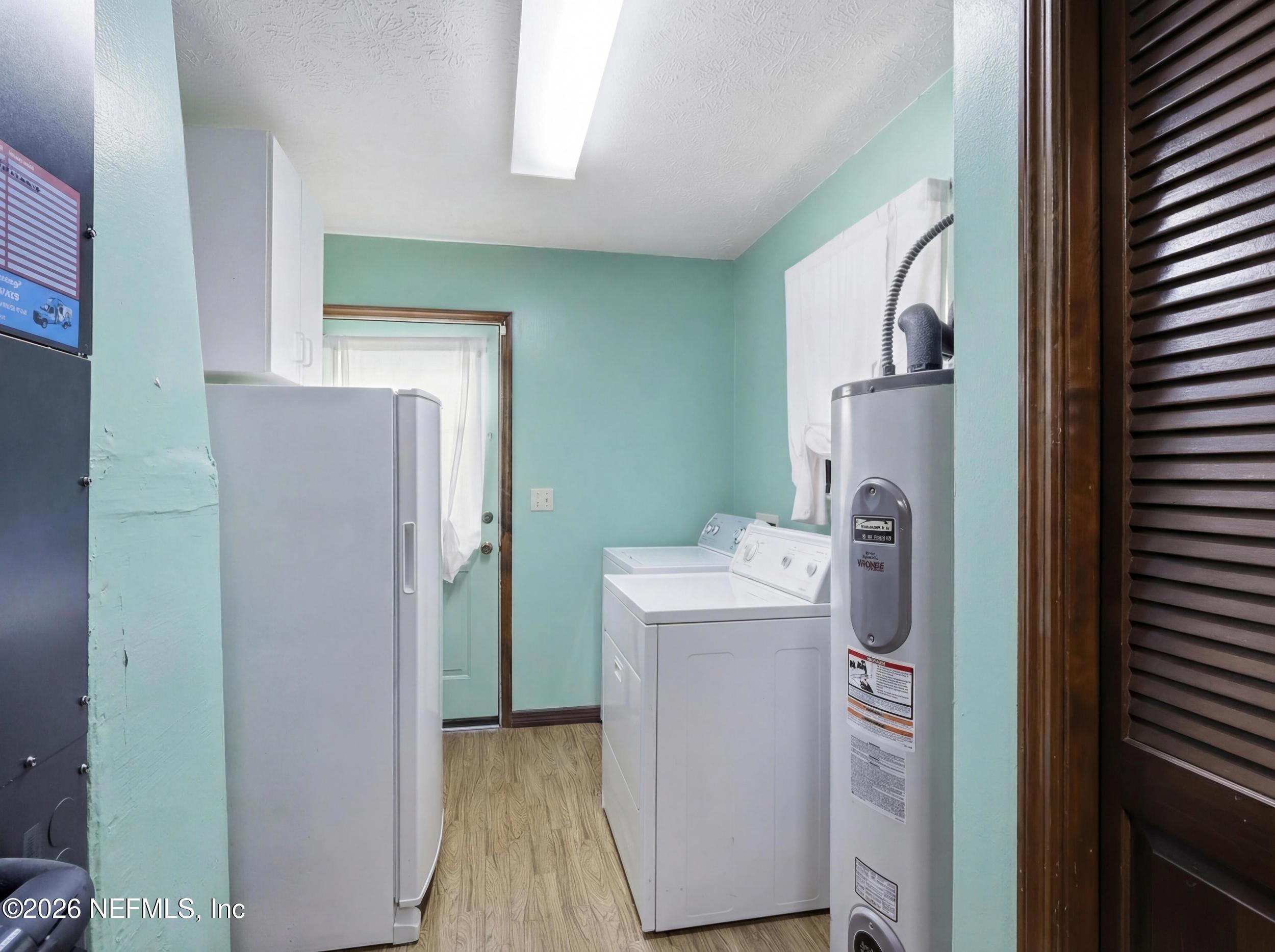 8336 Singleton Place Keystone Heights, FL 32656 - Photo 37 of 56 a utility room with dryer and washer
