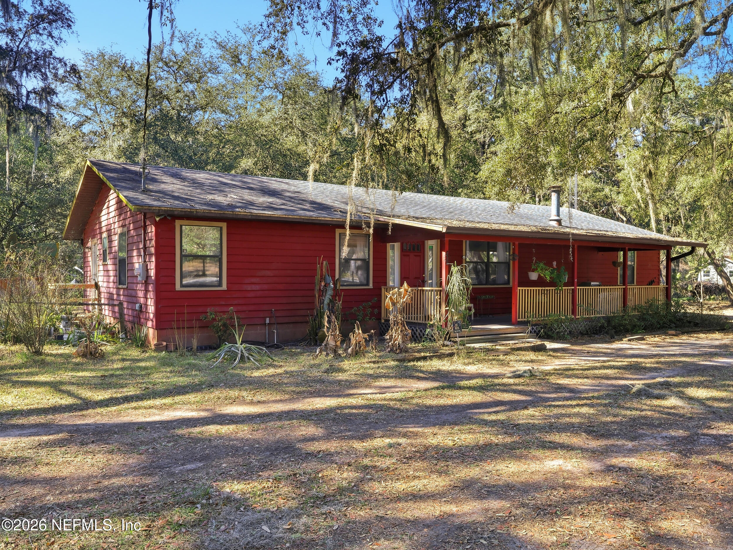 8336 Singleton Place Keystone Heights, FL 32656 - Photo 38 of 56 a view of a house with a tree in the yard