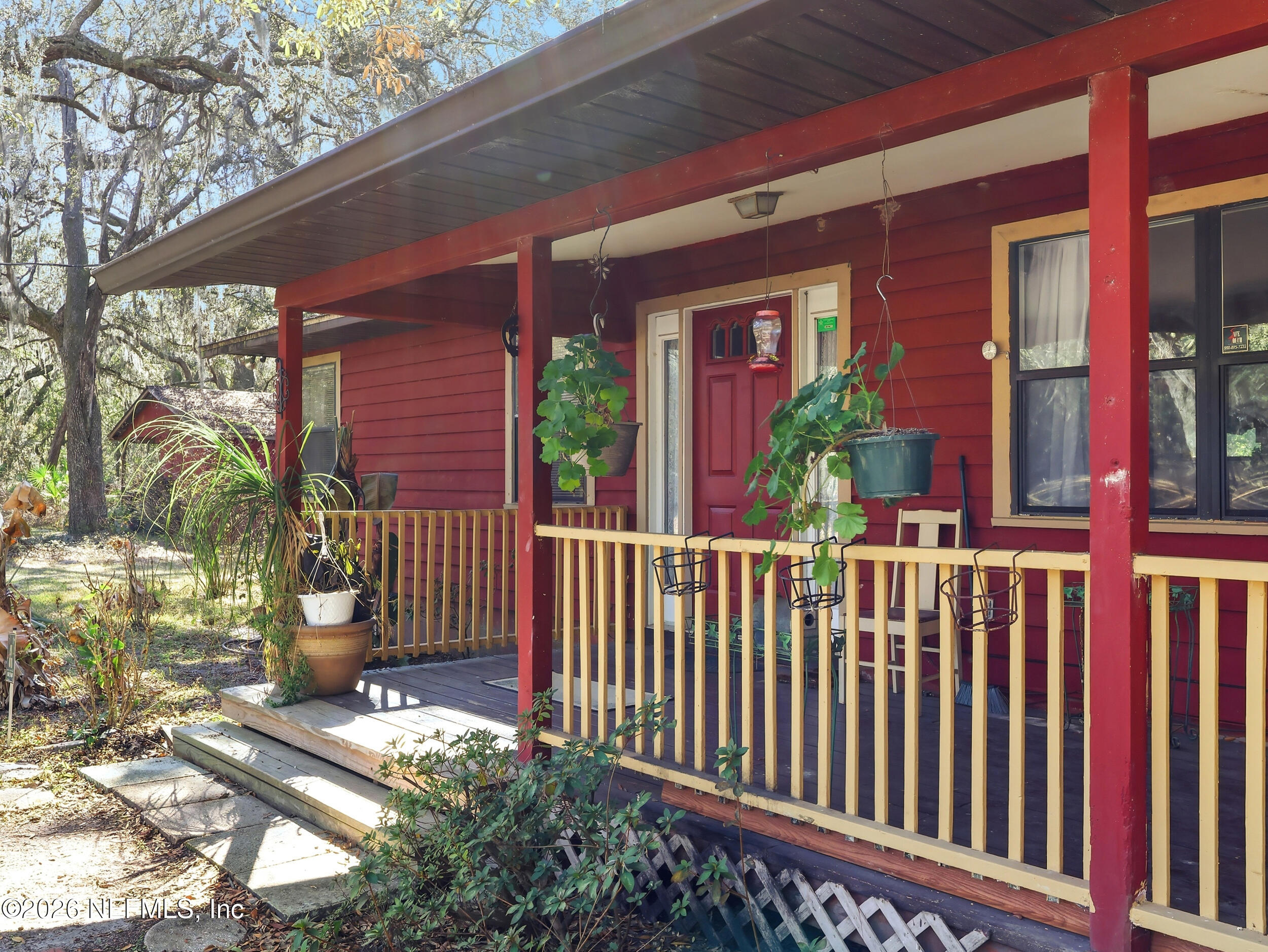8336 Singleton Place Keystone Heights, FL 32656 - Photo 40 of 56 a front view of a house with a garden