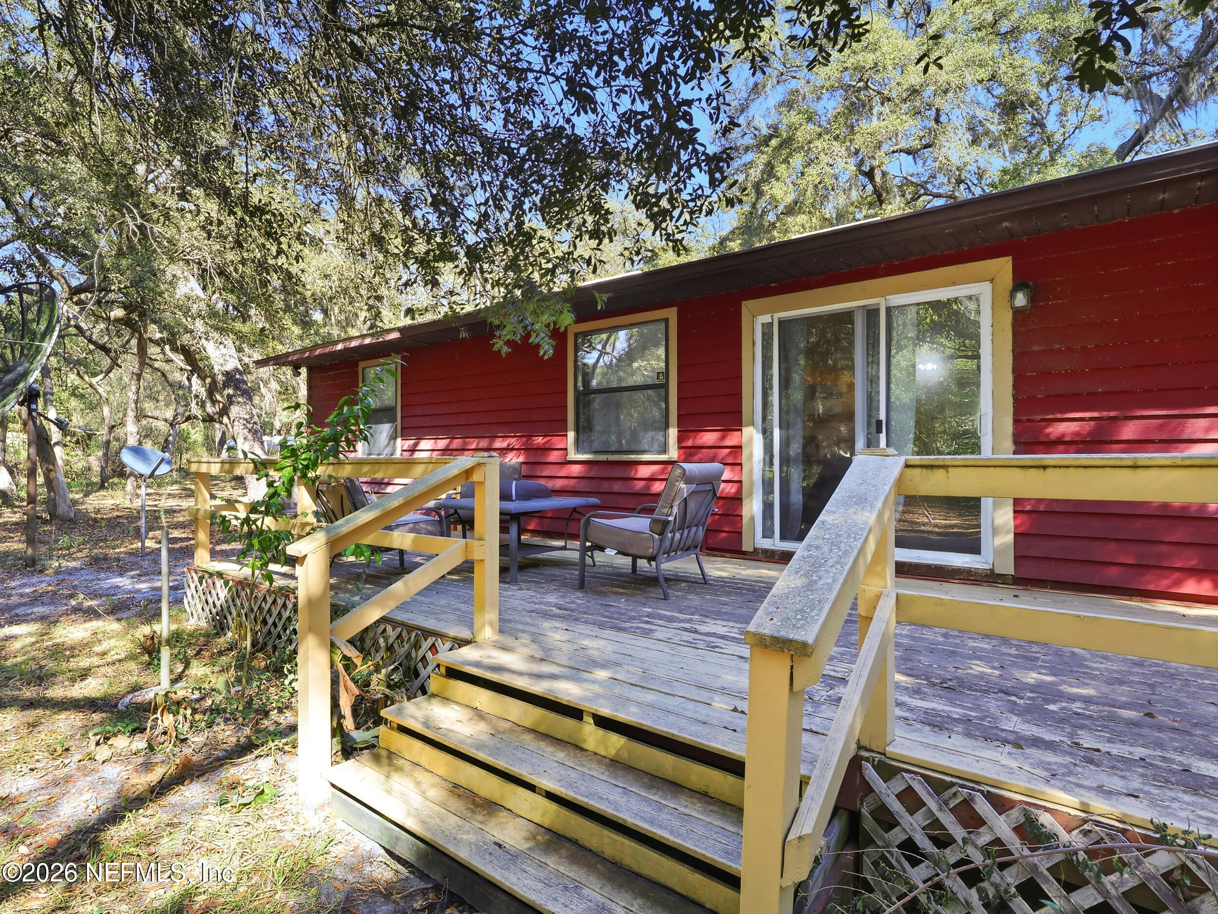 8336 Singleton Place Keystone Heights, FL 32656 - Photo 42 of 56 a view of a chairs and tables in the patio