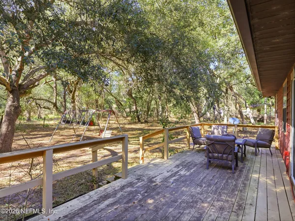 a view of a yard with an outdoor space