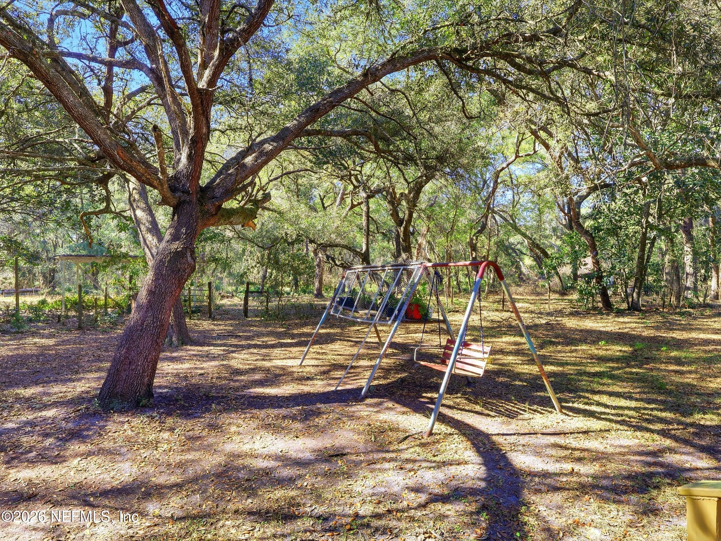 8336 Singleton Place Keystone Heights, FL 32656 - Photo 45 of 56 a view of a yard with basketball court