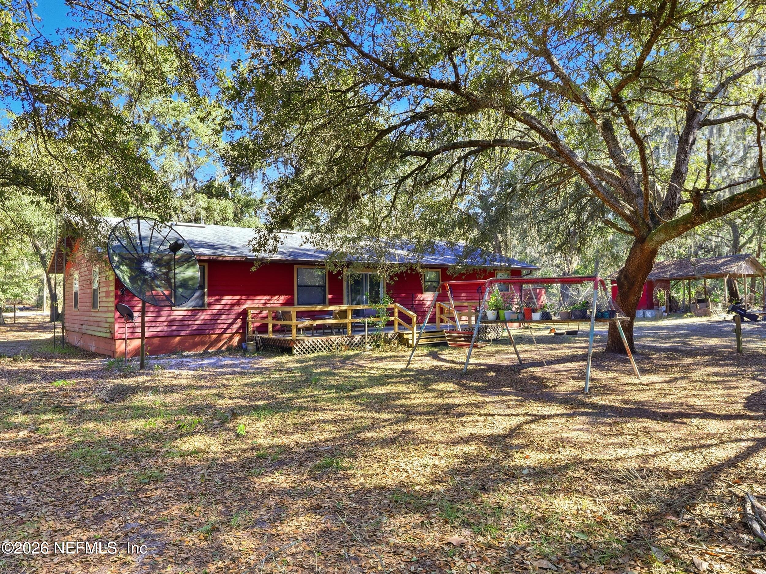 8336 Singleton Place Keystone Heights, FL 32656 - Photo 49 of 56 a view of a yard with an outdoor space