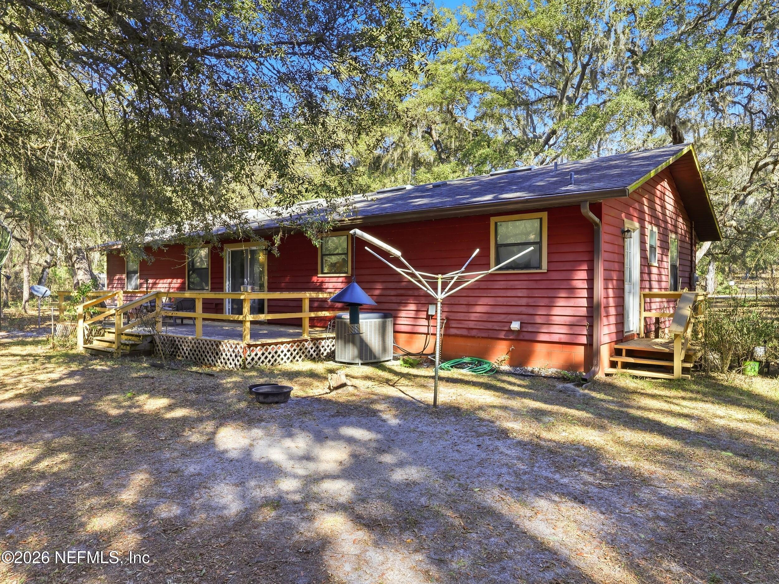 8336 Singleton Place Keystone Heights, FL 32656 - Photo 50 of 56 a view of a house with a large tree