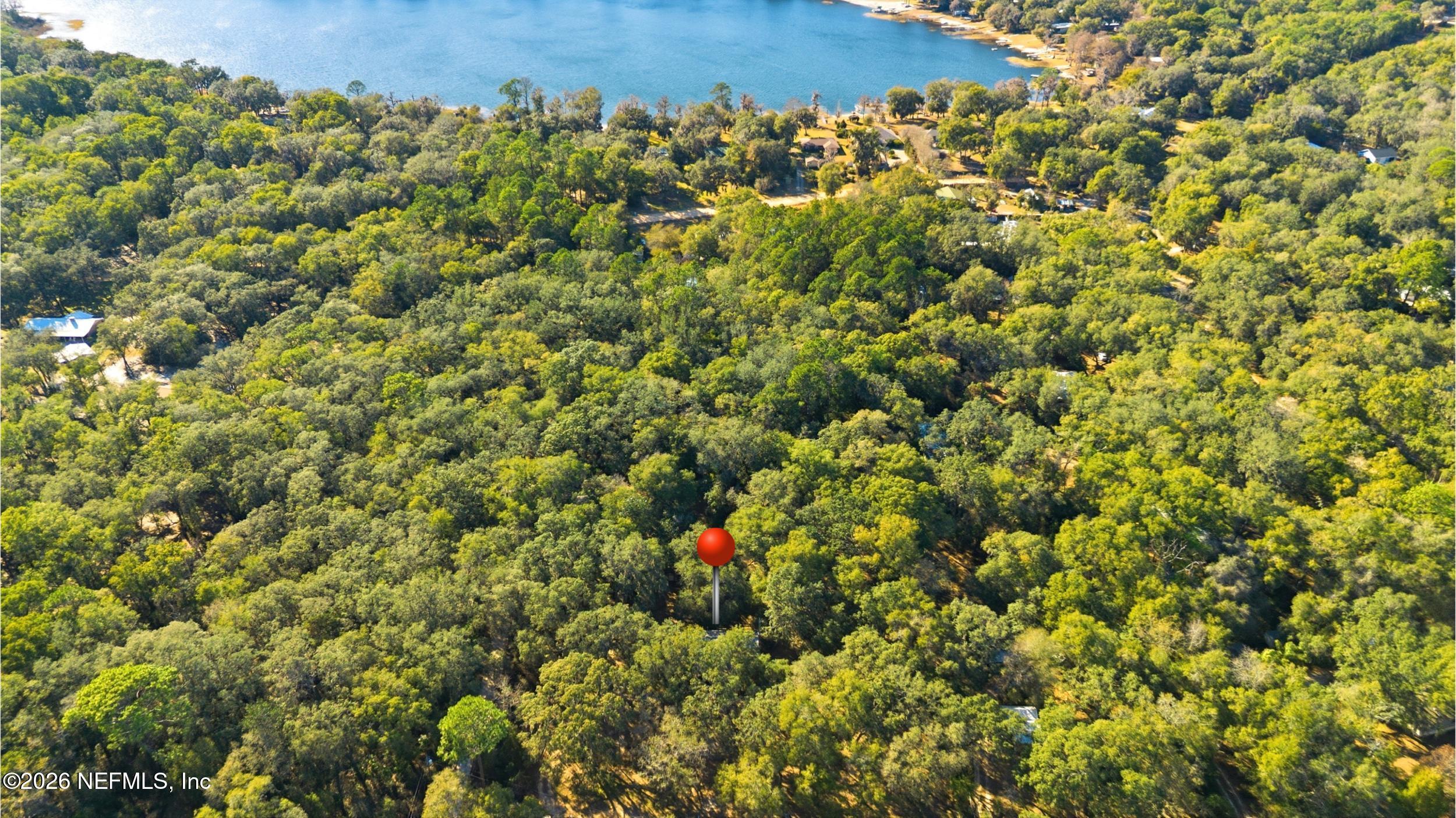 8336 Singleton Place Keystone Heights, FL 32656 - Photo 53 of 56 an aerial view of a house with a yard