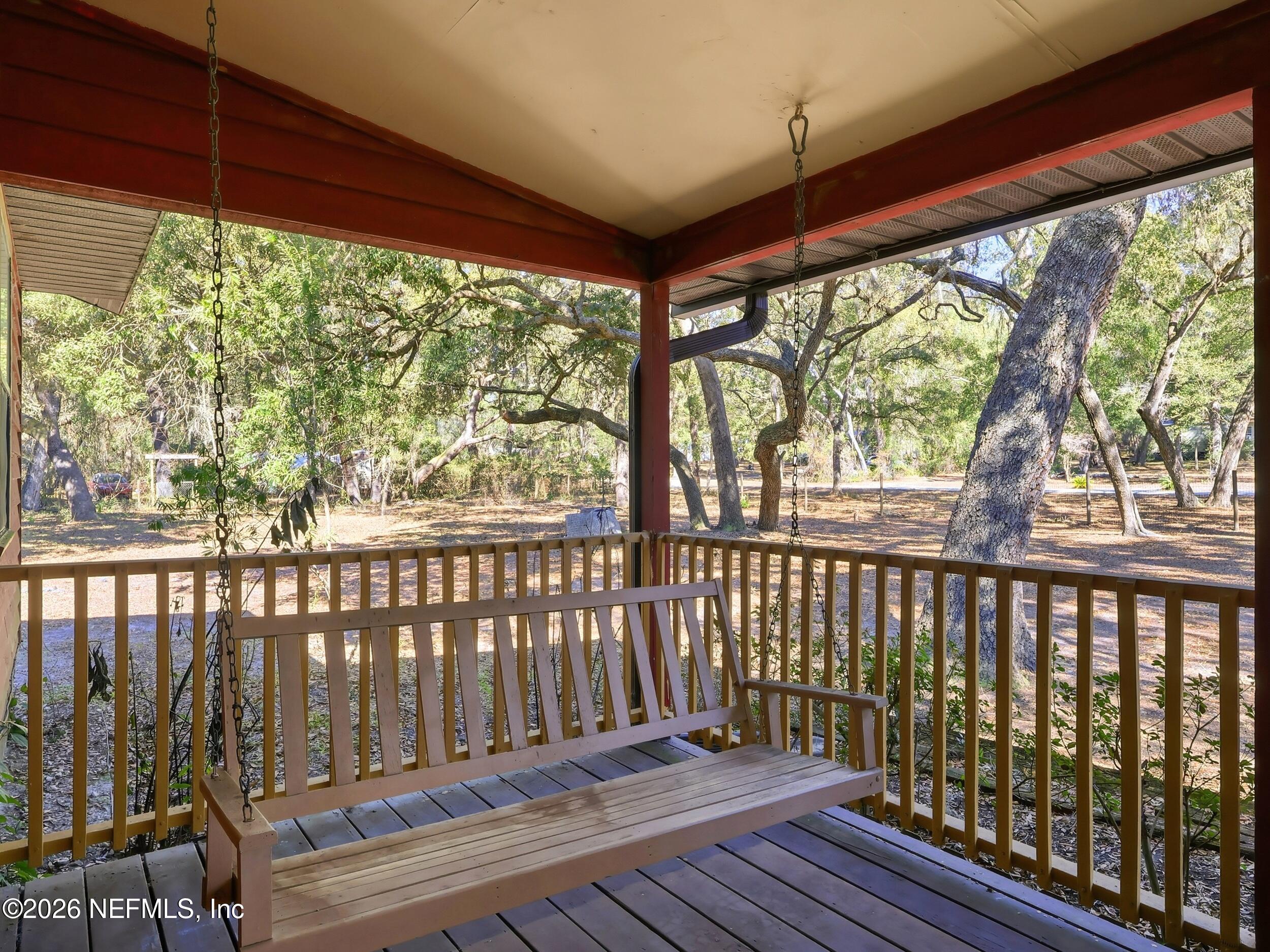 8336 Singleton Place Keystone Heights, FL 32656 - Photo 8 of 56 a view of a porch with wooden floor