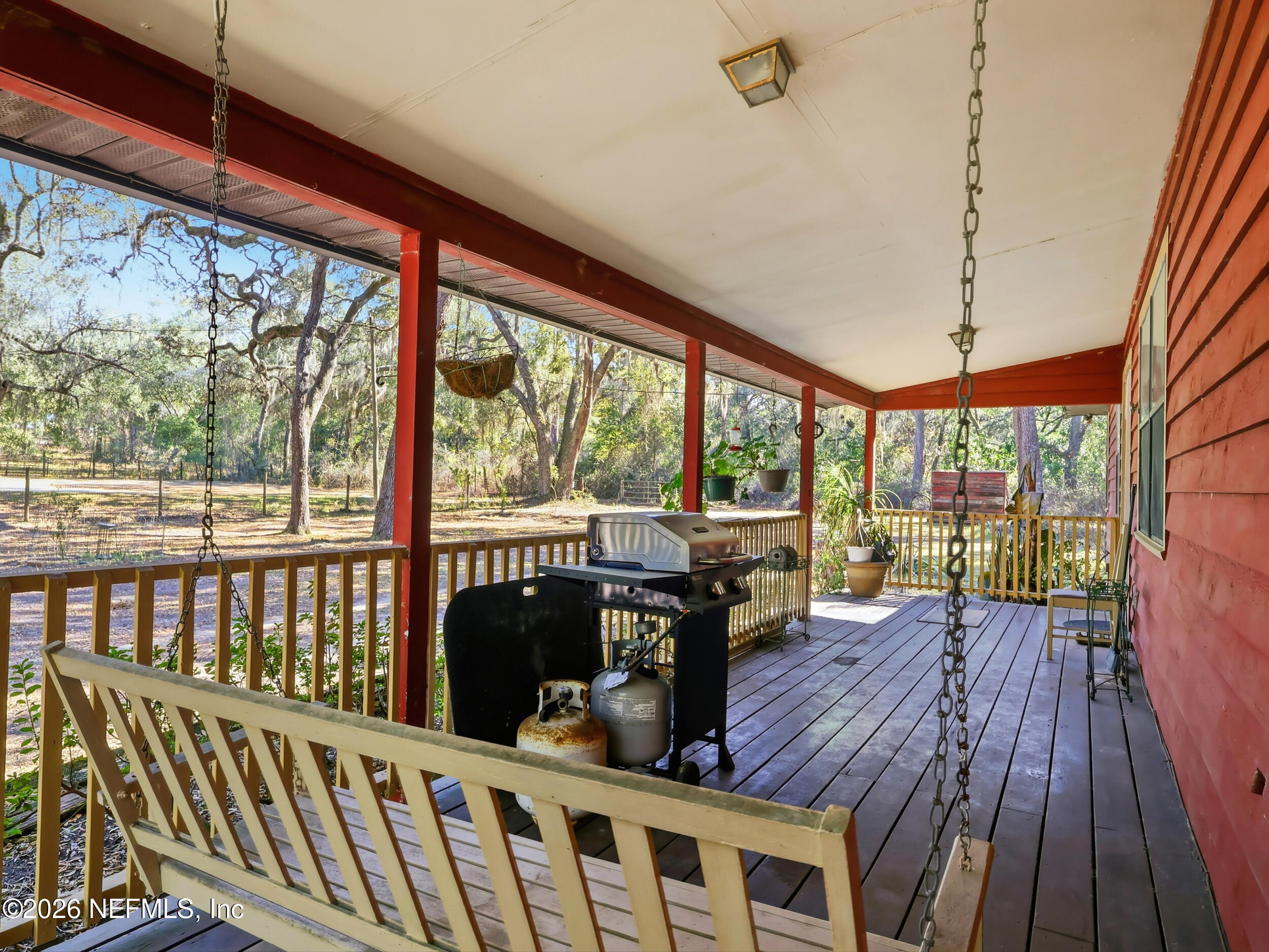 8336 Singleton Place Keystone Heights, FL 32656 - Photo 9 of 56 a view of a balcony with furniture and wooden floor