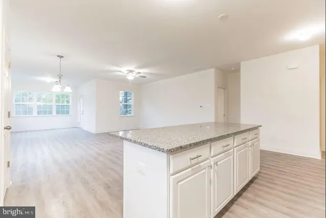 a view of a kitchen counter space with wooden floor
