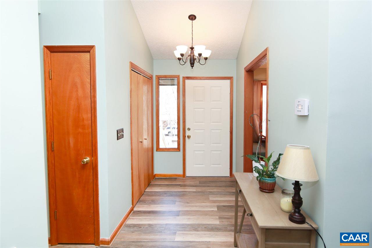 12 Dogleg Road Palmyra, VA 22963 - Photo 3 of 46 a very nice looking room with wooden floor and a chandelier