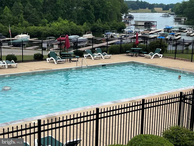 a view of a swimming pool with chairs
