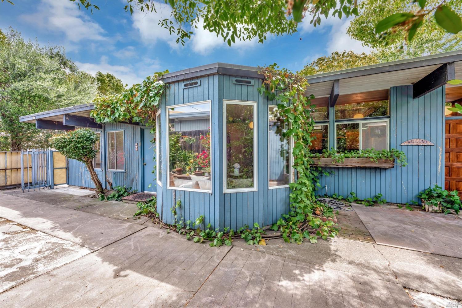 a front view of a house with garden