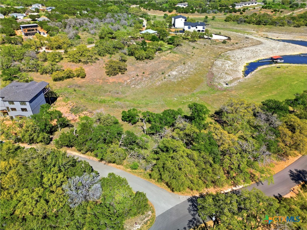 1309 Emerald Road Lago Vista, TX 78645 - Photo 15 of 26 a view of a lake with beach
