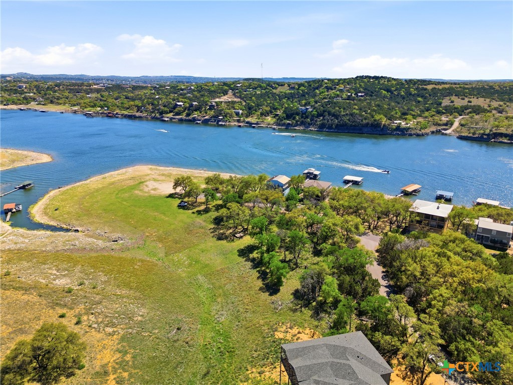 1309 Emerald Road Lago Vista, TX 78645 - Photo 4 of 26 a view of a lake with a houses