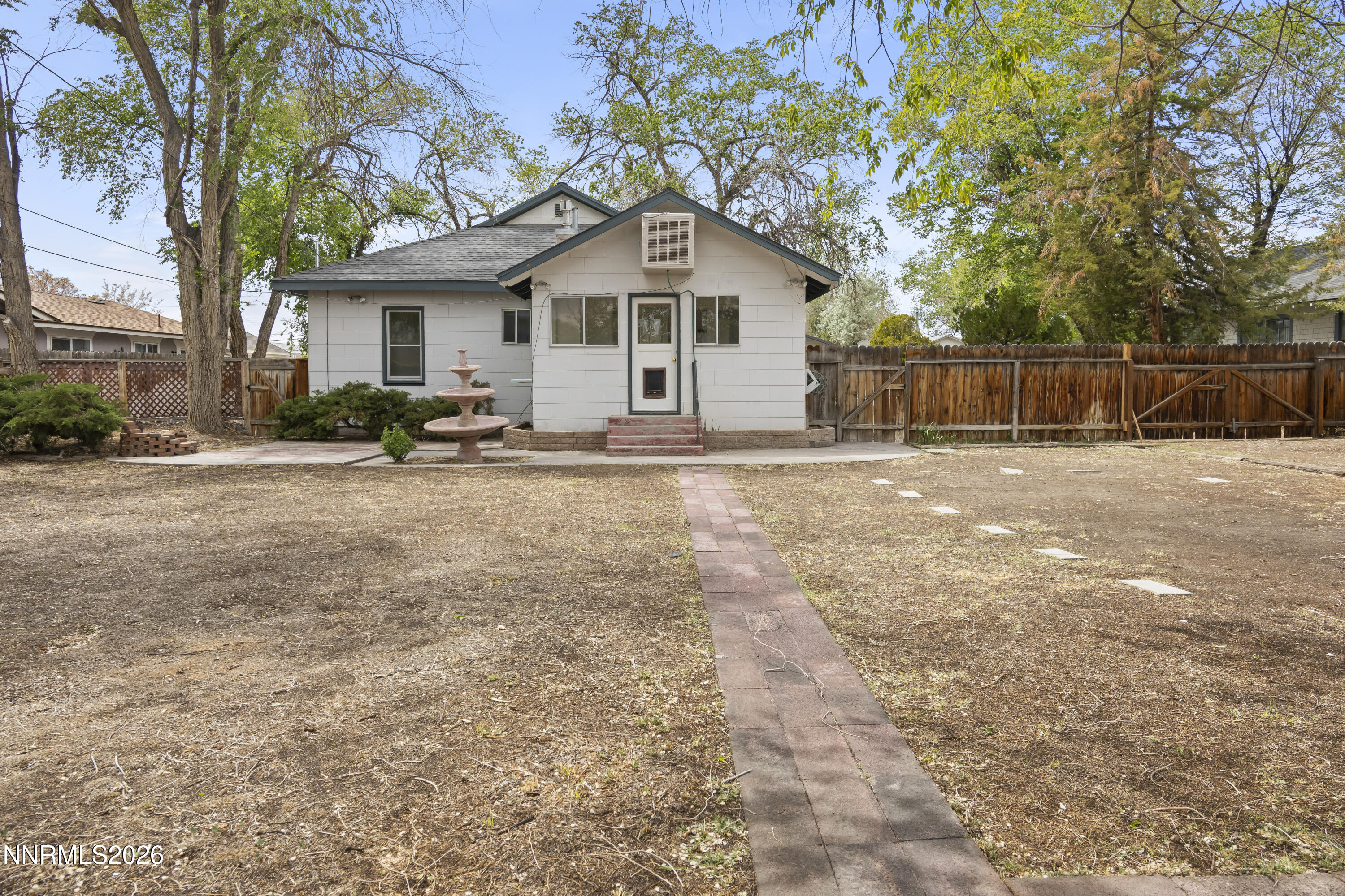 511 Churchill Street Fallon, NV 89406 - Photo 22 of 37 a view of a house with backyard and trees