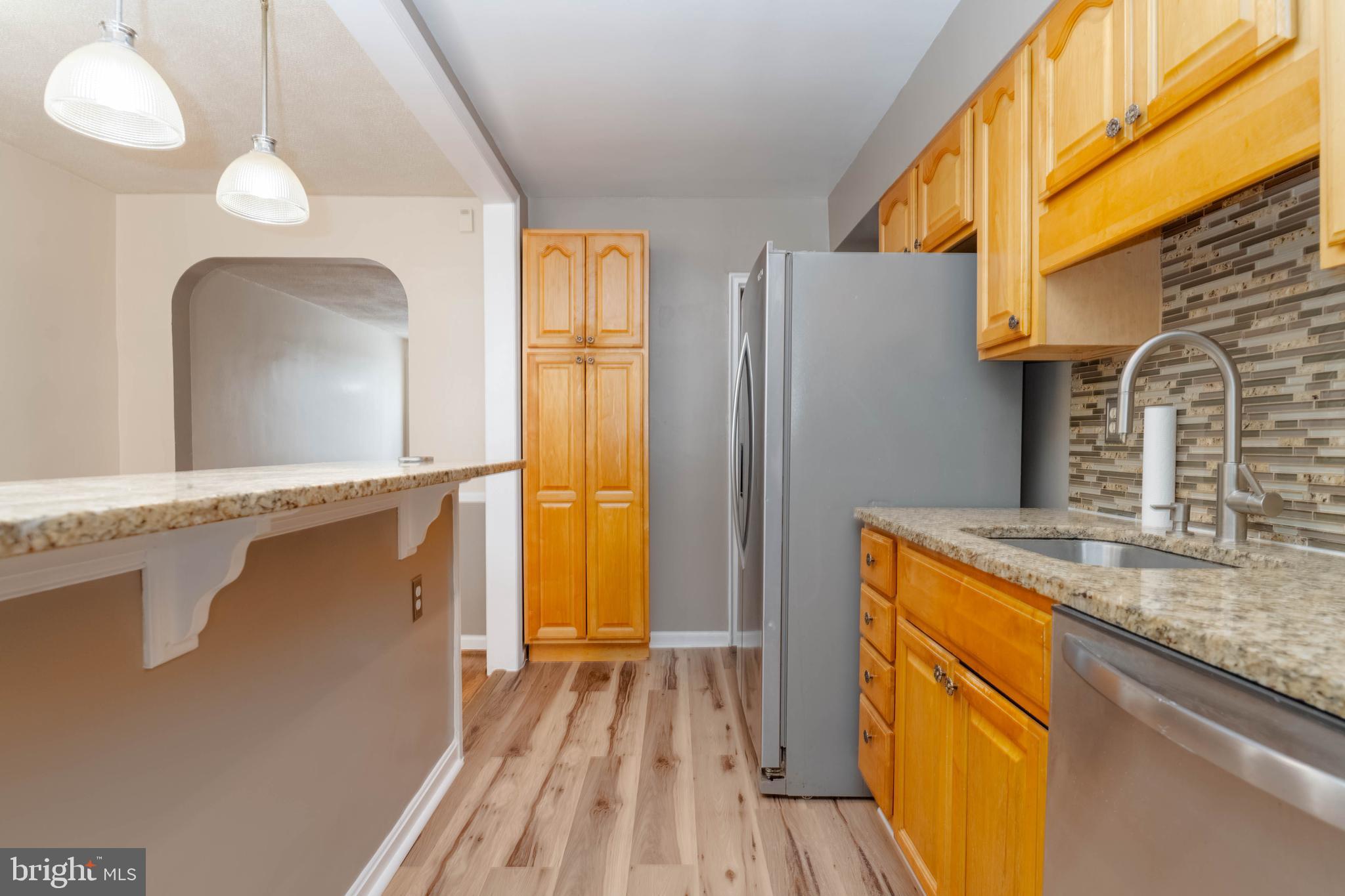 5413 Channing Road Baltimore, MD 21229 - Photo 15 of 45 a kitchen with stainless steel appliances granite countertop a refrigerator a sink and a stove