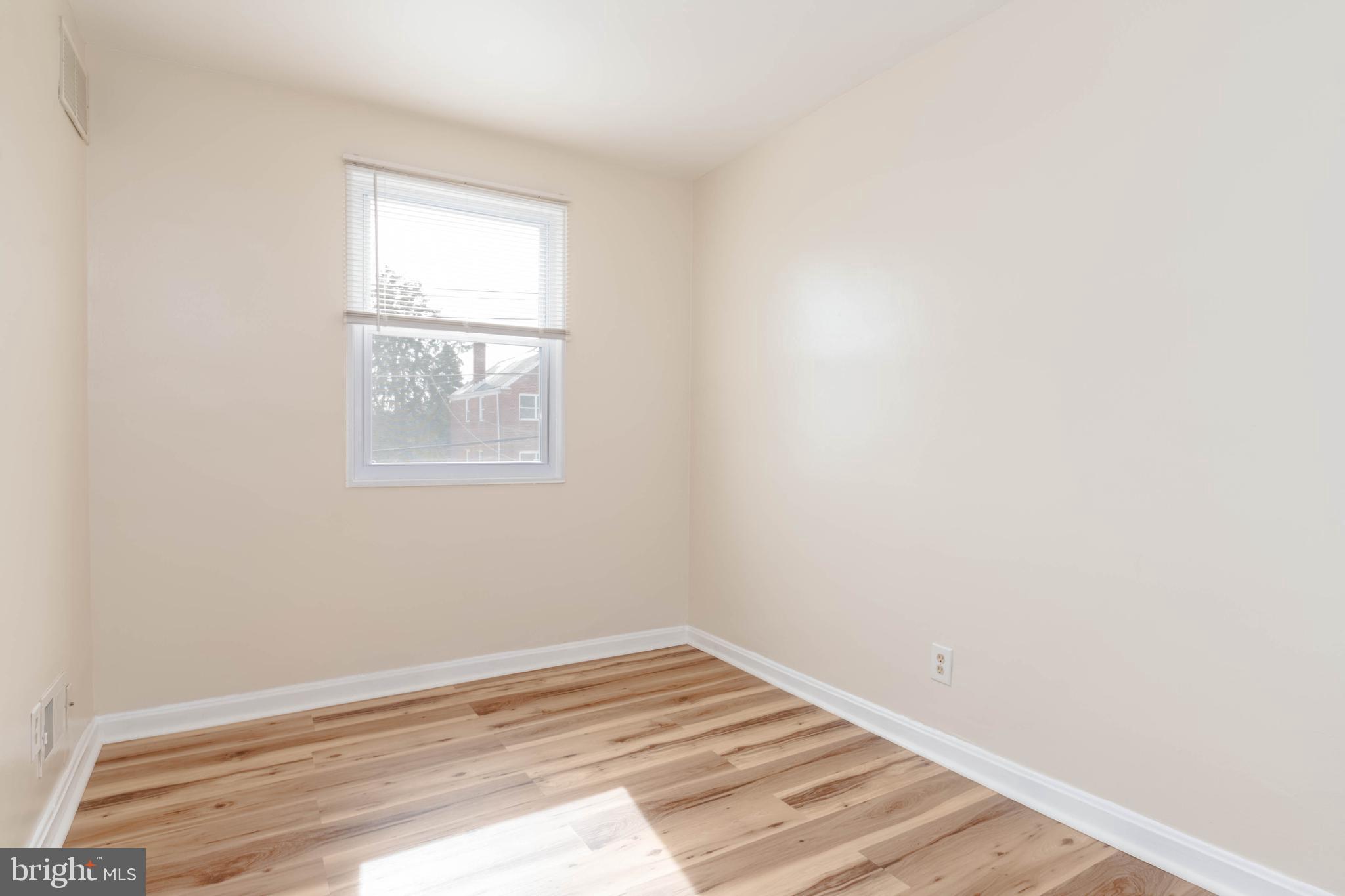 5413 Channing Road Baltimore, MD 21229 - Photo 17 of 45 an empty room with a window