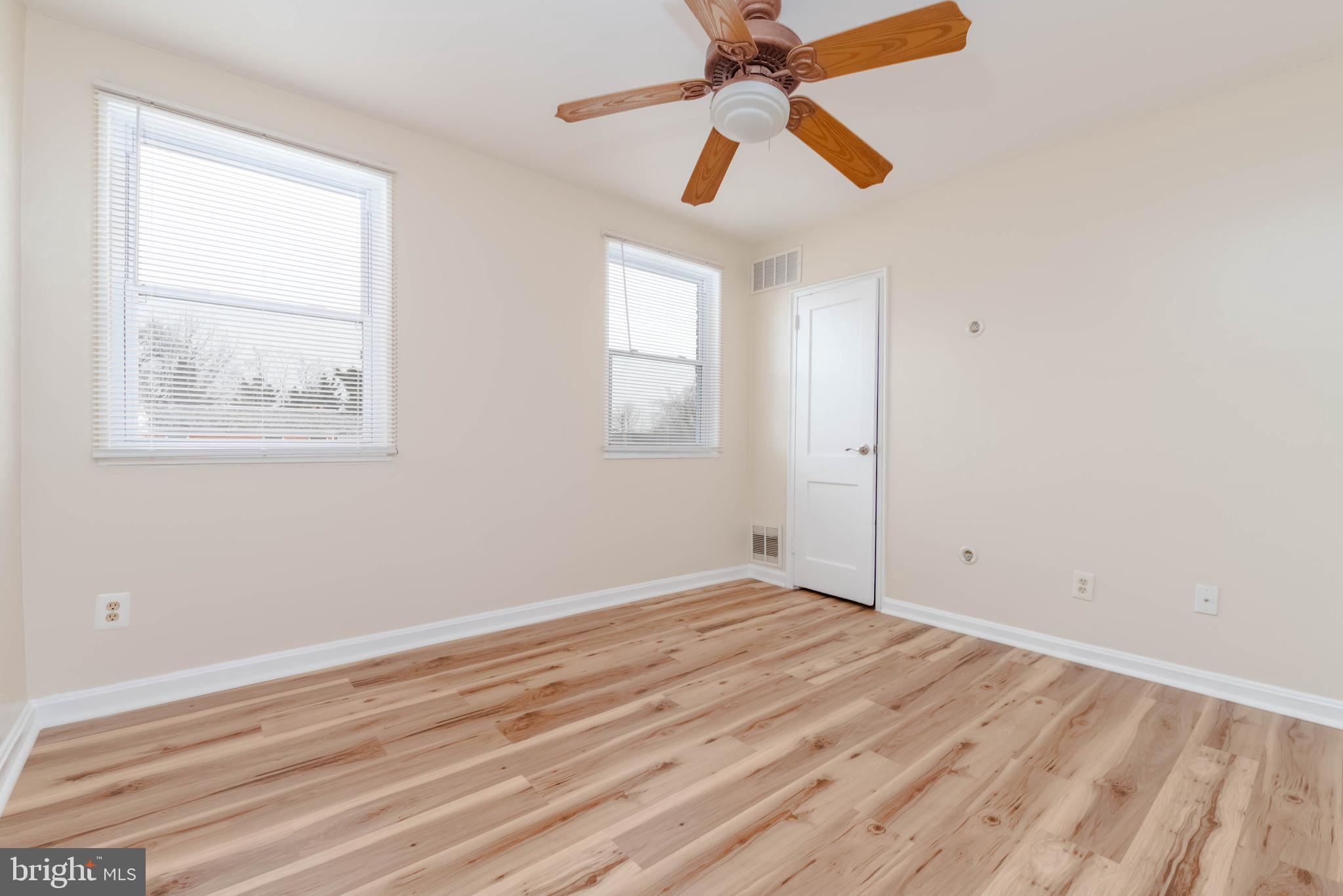 5413 Channing Road Baltimore, MD 21229 - Photo 25 of 45 wooden floor in an empty room with a window