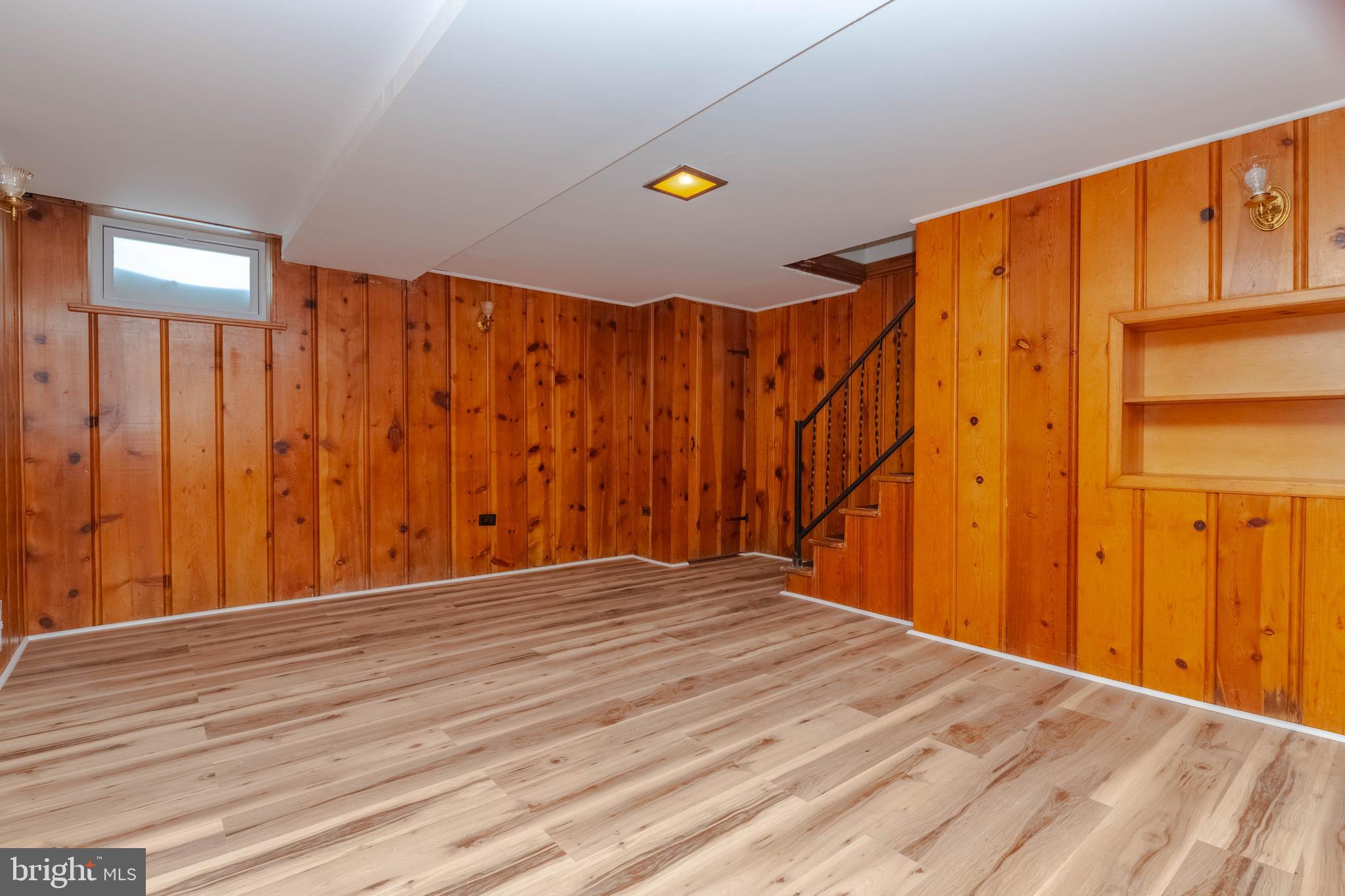 5413 Channing Road Baltimore, MD 21229 - Photo 32 of 45 a view of a room with wooden floor and a window