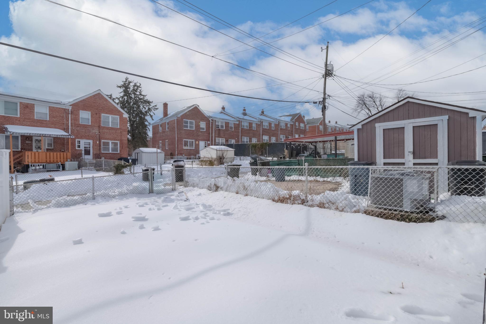 5413 Channing Road Baltimore, MD 21229 - Photo 40 of 45 a view of a house with a snow in the yard