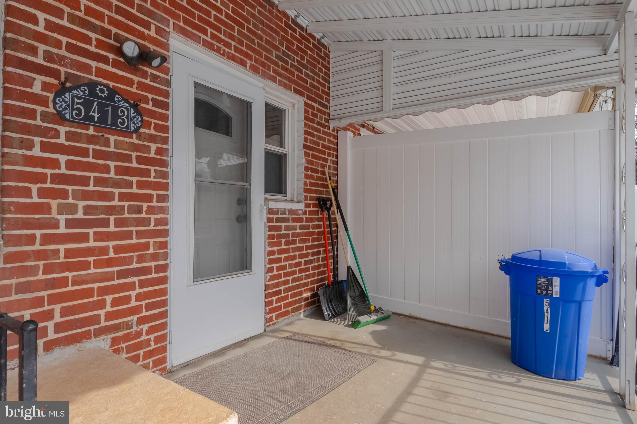 5413 Channing Road Baltimore, MD 21229 - Photo 45 of 45 a view of wooden door and brick walls